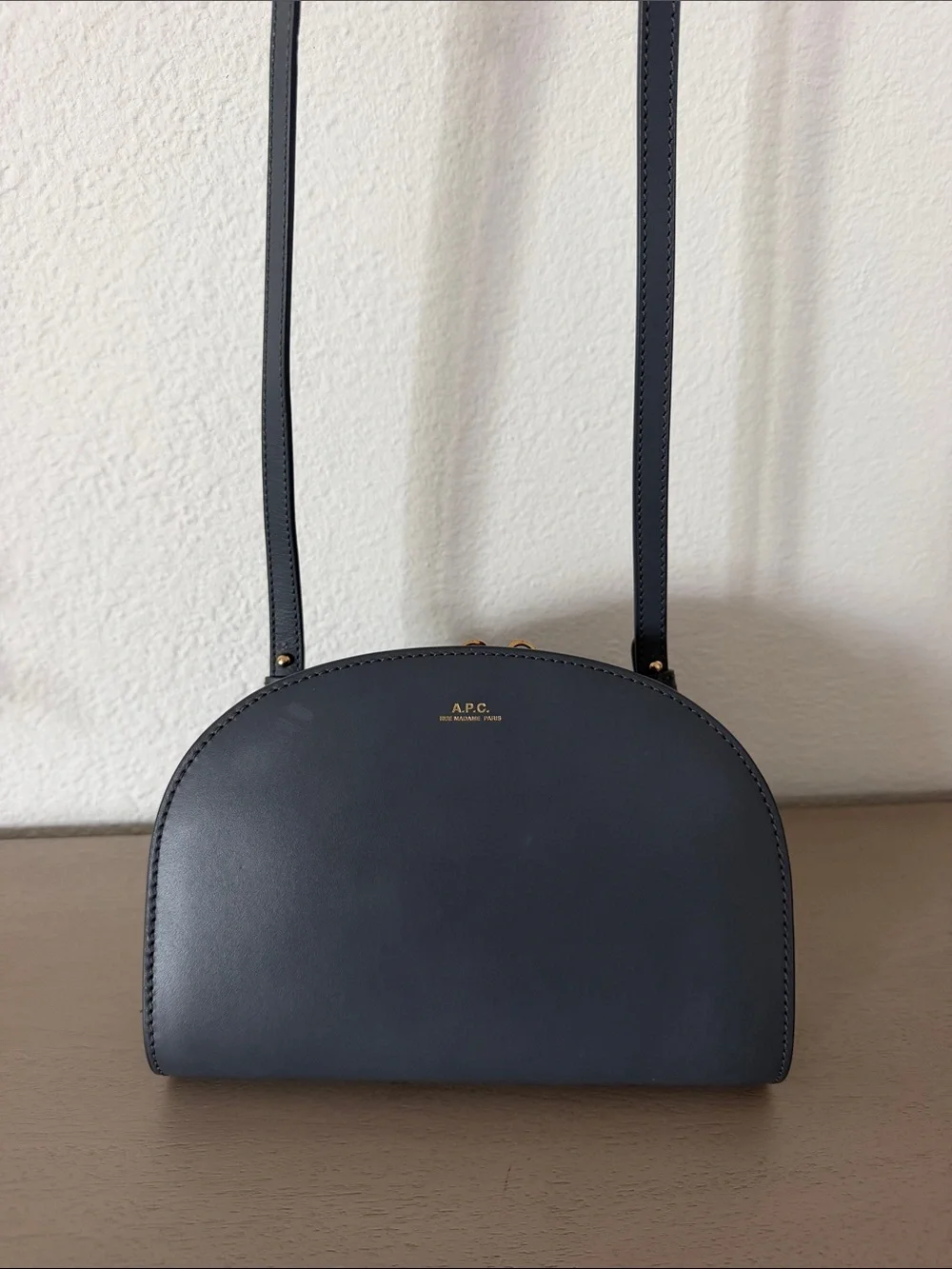 A.P.C. Half-Moon Leather Crossbody Bag in Black with Gold Logo